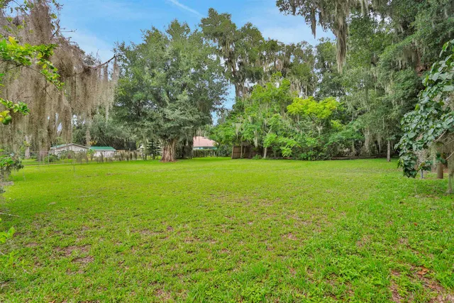 a view of a garden with a house