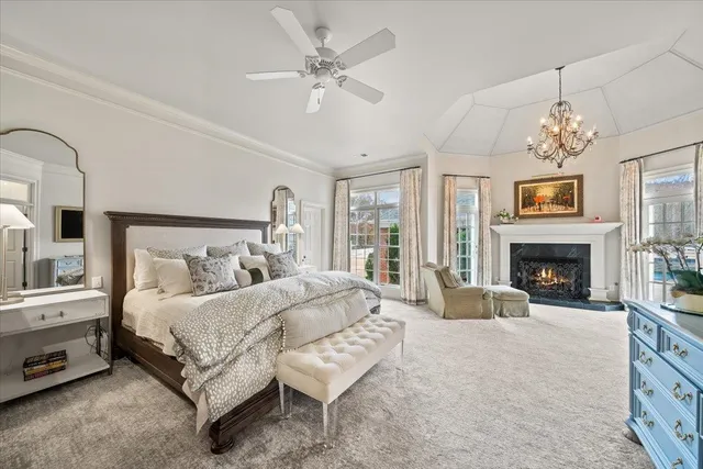 a bedroom with a bed and a fireplace