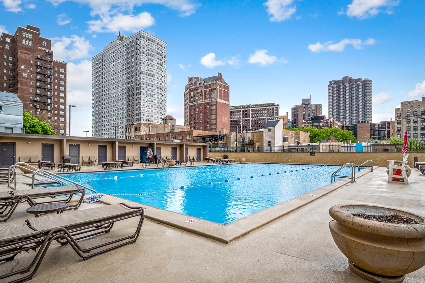 655 West Irving Park Road, Unit 1502 Chicago, IL 60613 - Photo 13 of 24 a view of swimming pool with outdoor seating and city view