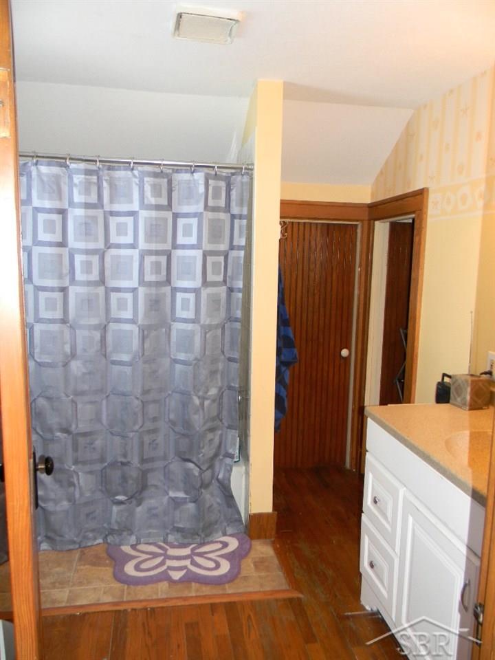 4567 West Freeland Road Saginaw, MI 48604 - Photo 29 of 38 Second floor full bath with updated vanity and tile surround in the shower/tub. Lg closest and access to addition upstairs storage.