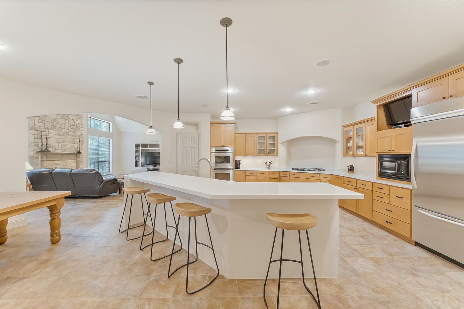 24311 Standing Oak Drive Spring, TX 77389 - Photo 17 of 42 a large kitchen with a table and chairs