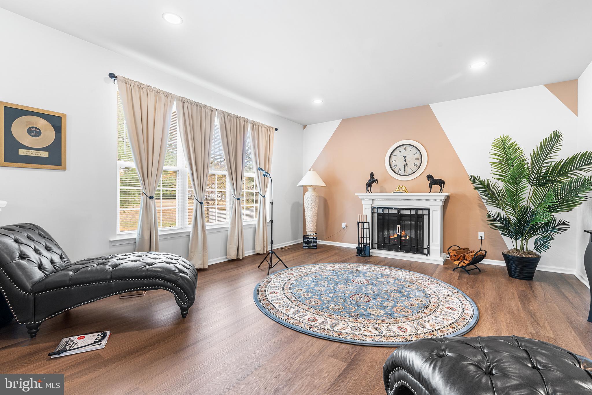 19 Howard Street Carneys Point, NJ 08069 - Photo 17 of 39 a living room with furniture and a fireplace