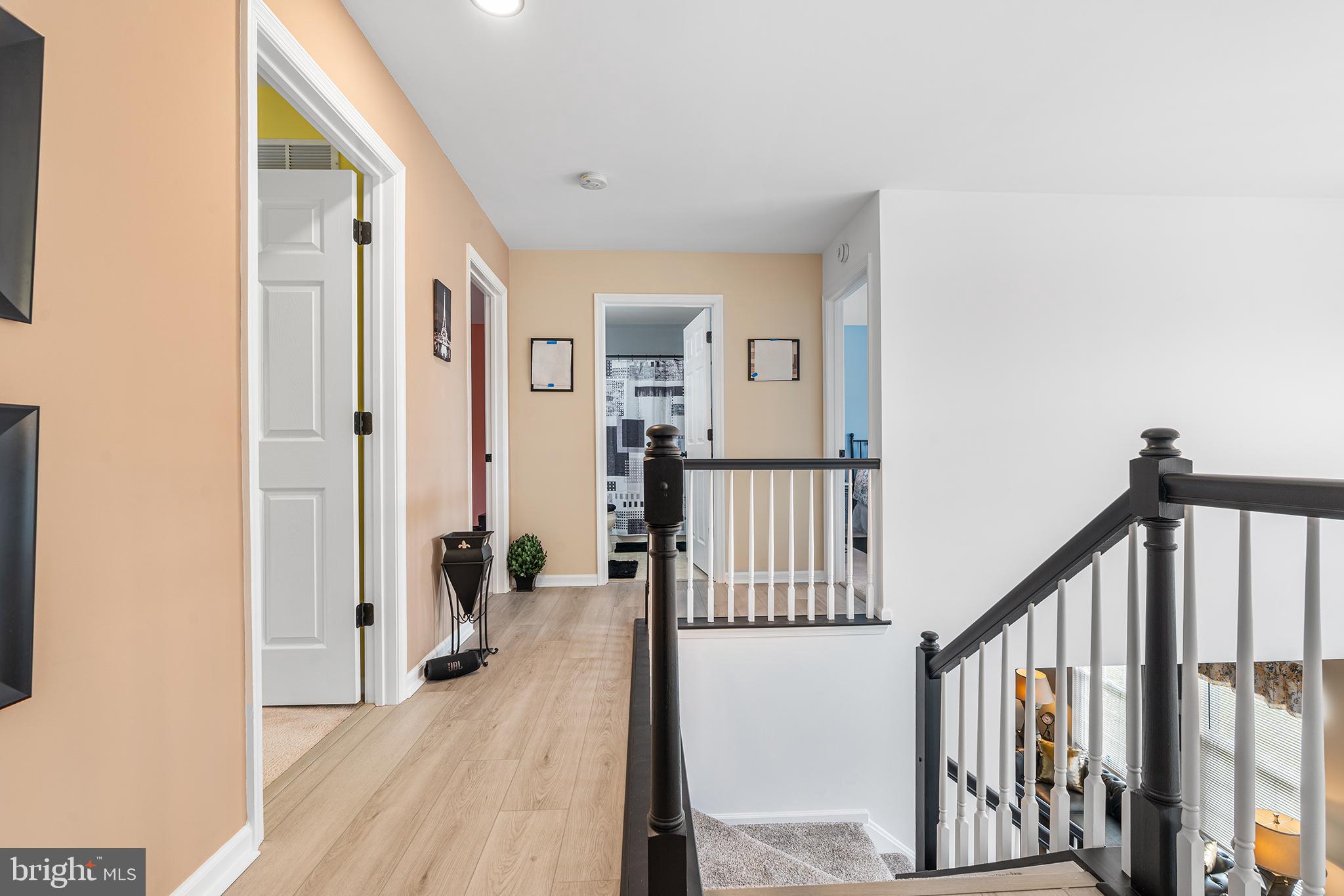 19 Howard Street Carneys Point, NJ 08069 - Photo 22 of 39 a view of a livingroom with wooden floor and stairs