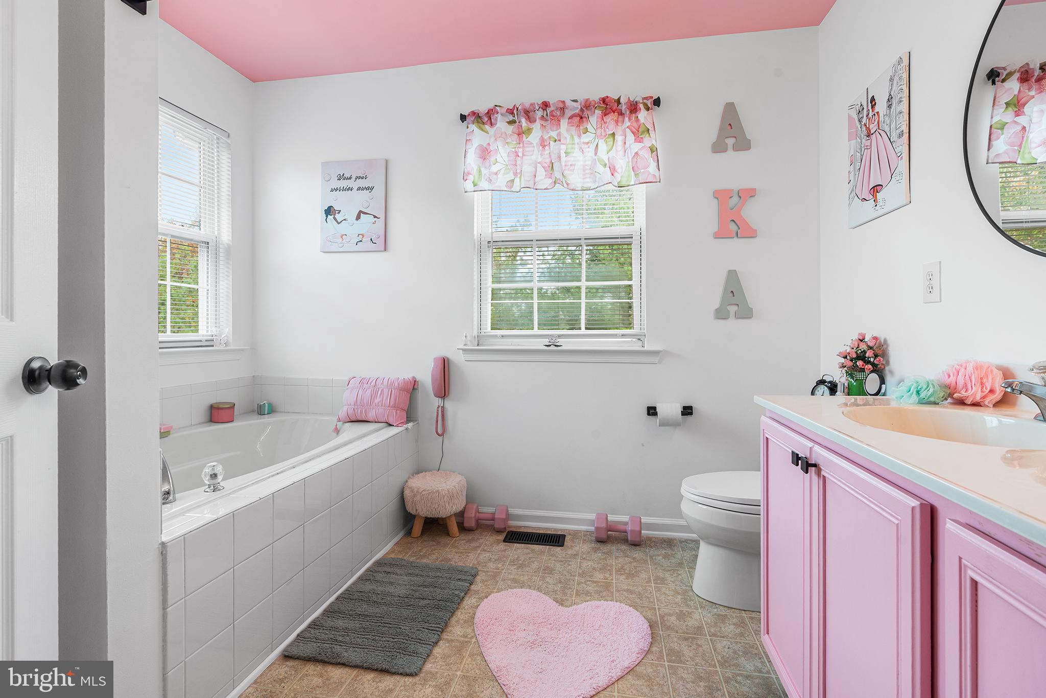 19 Howard Street Carneys Point, NJ 08069 - Photo 26 of 39 a bathroom with a bath tub a sink and a toilet