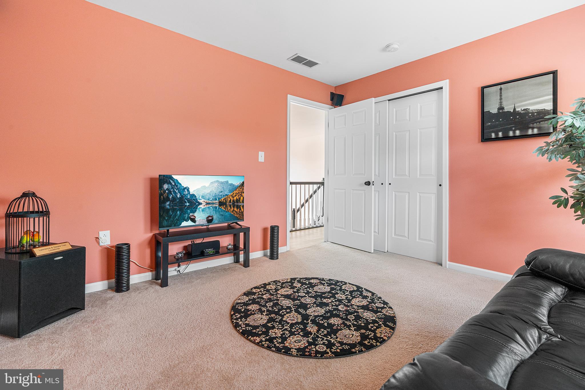19 Howard Street Carneys Point, NJ 08069 - Photo 31 of 39 a living room with furniture a rug and a flat screen tv
