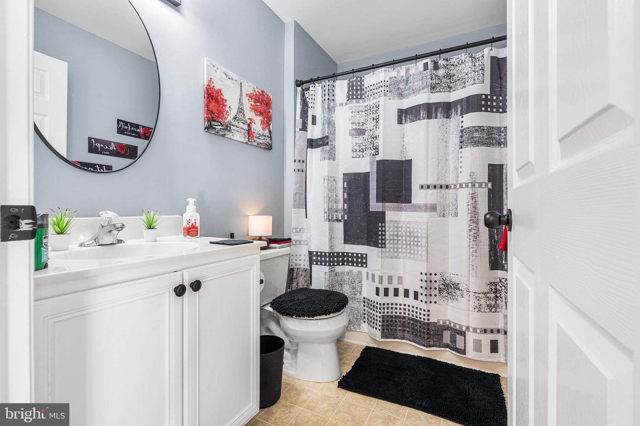 19 Howard Street Carneys Point, NJ 08069 - Photo 32 of 39 a bathroom with a sink and a mirror