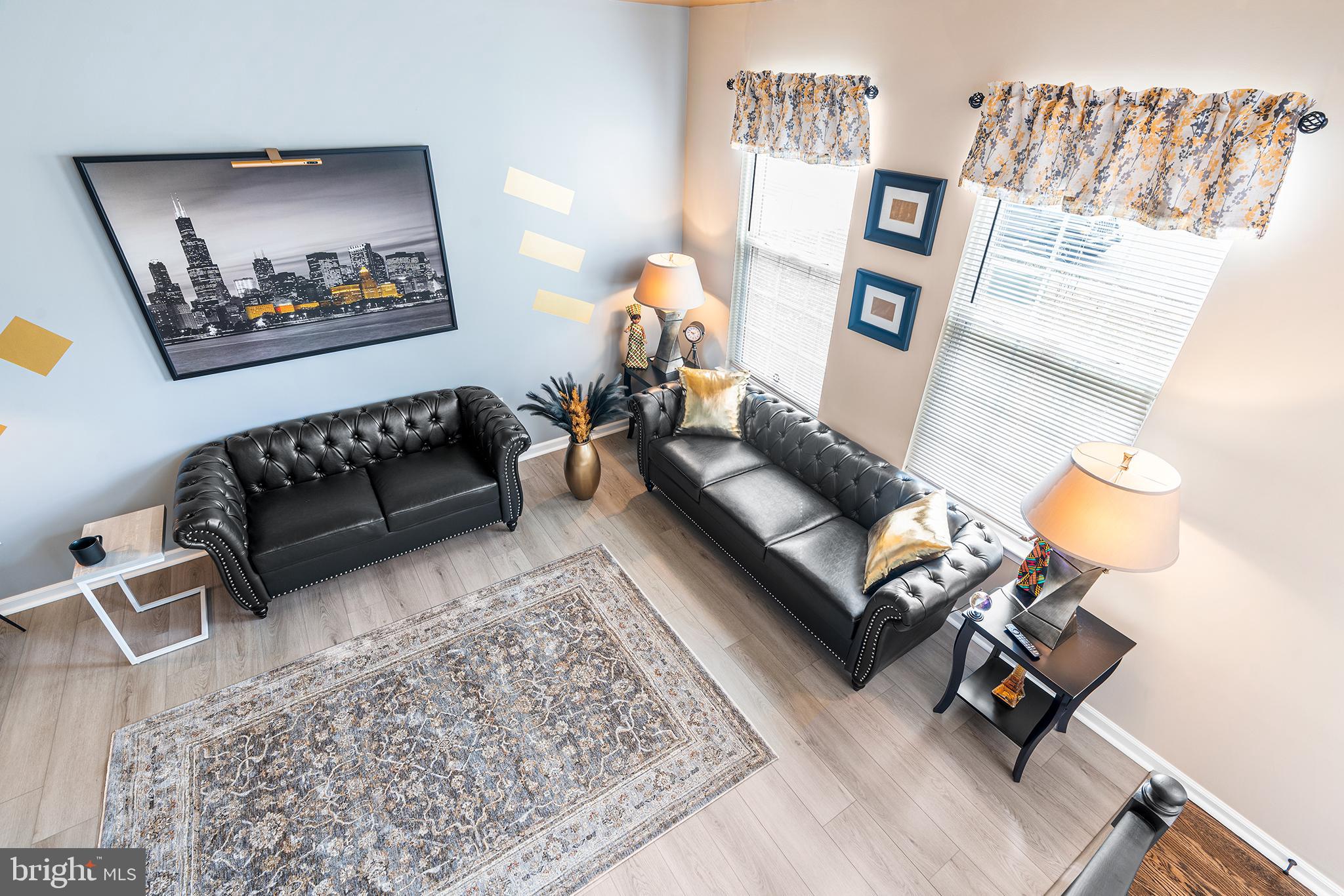 19 Howard Street Carneys Point, NJ 08069 - Photo 8 of 39 a living room with furniture and a rug
