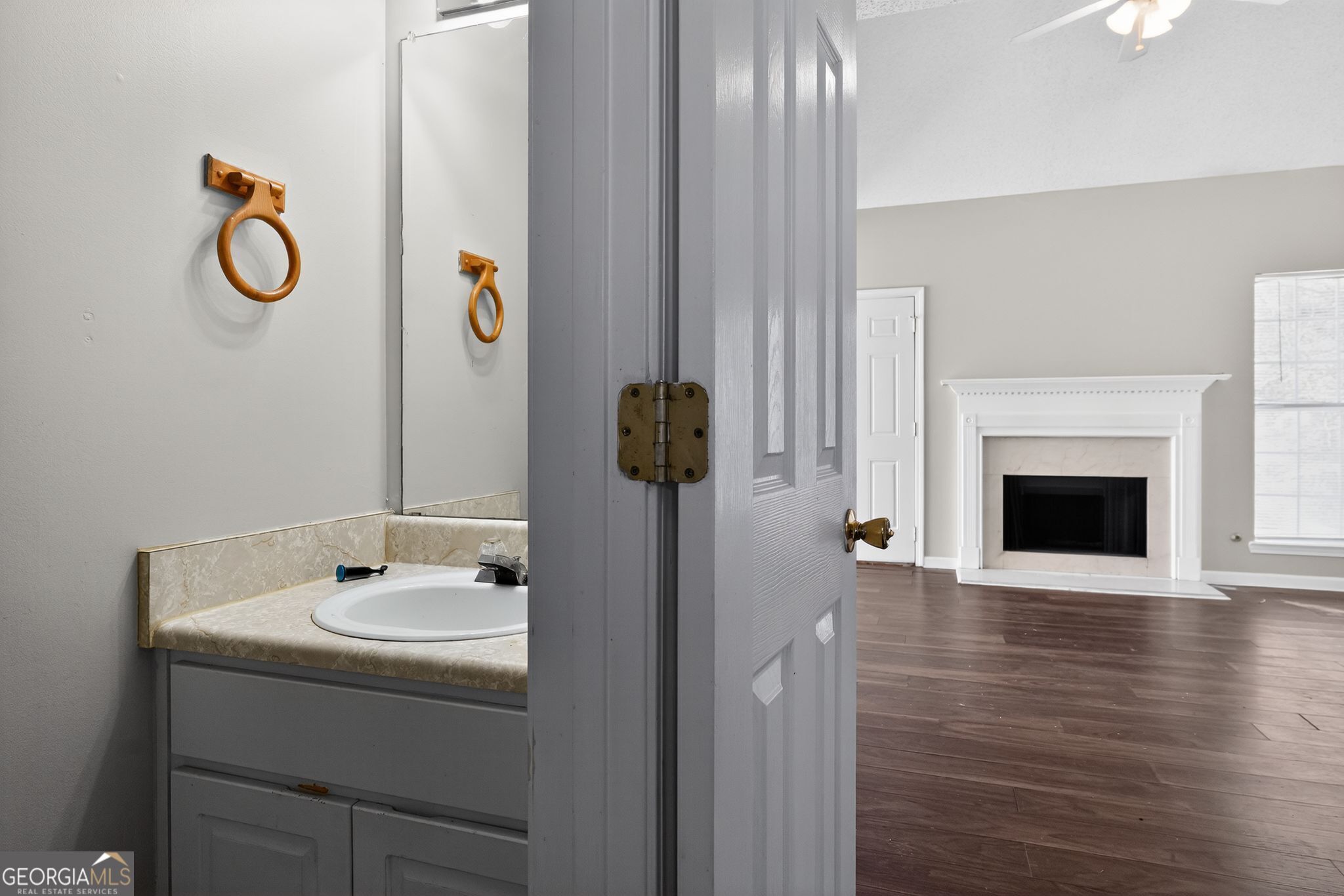 4708 Golod Way Lithonia, GA 30038 - Photo 11 of 33 a bathroom with a sink and a mirror
