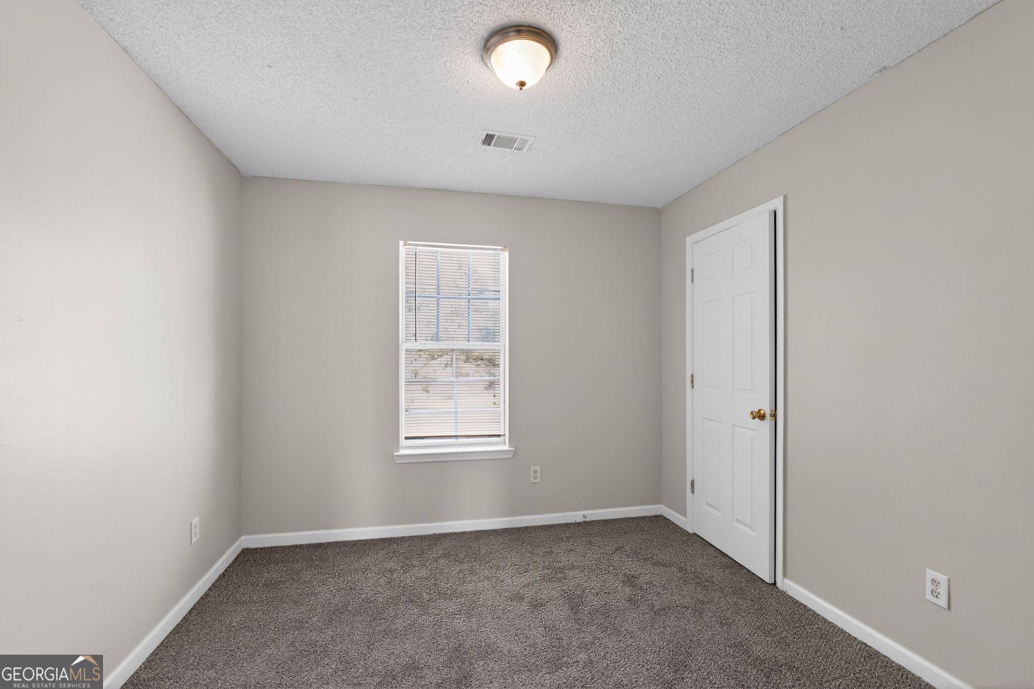 4708 Golod Way Lithonia, GA 30038 - Photo 18 of 33 an empty room with windows