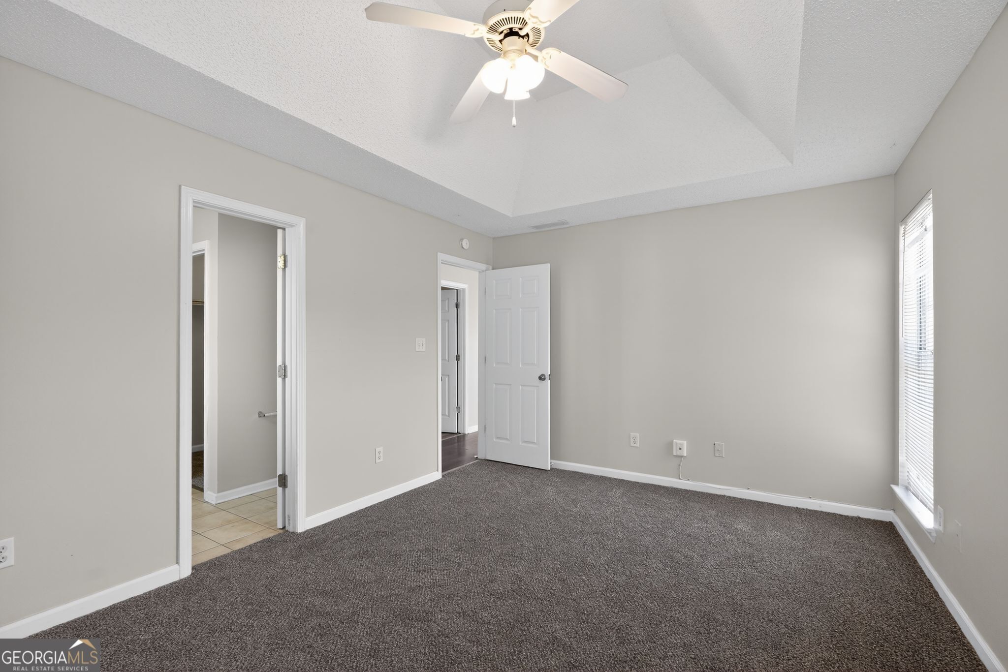 4708 Golod Way Lithonia, GA 30038 - Photo 22 of 33 a view of an empty room and chandelier fan