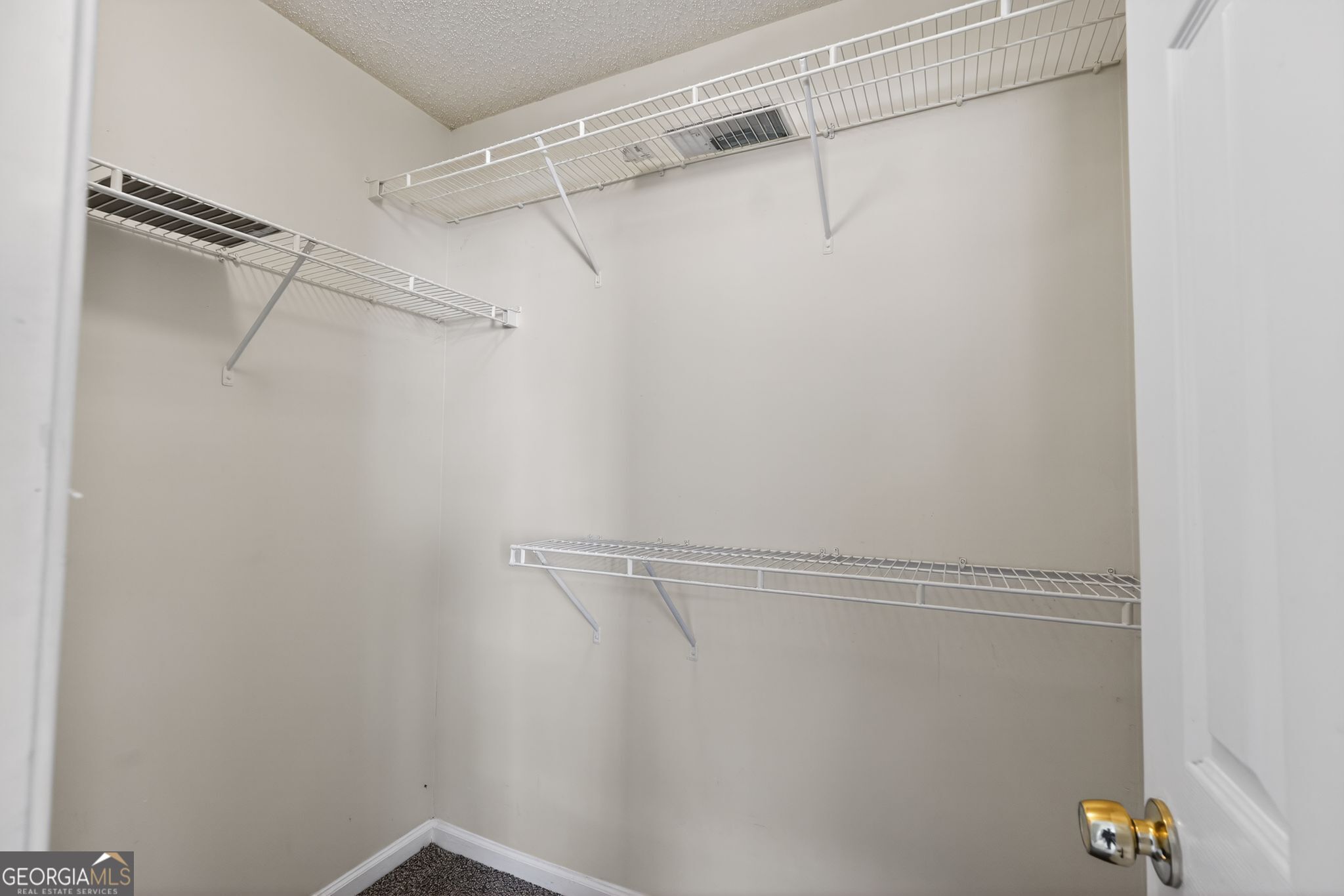 4708 Golod Way Lithonia, GA 30038 - Photo 27 of 33 a view of a room with racks on the wall