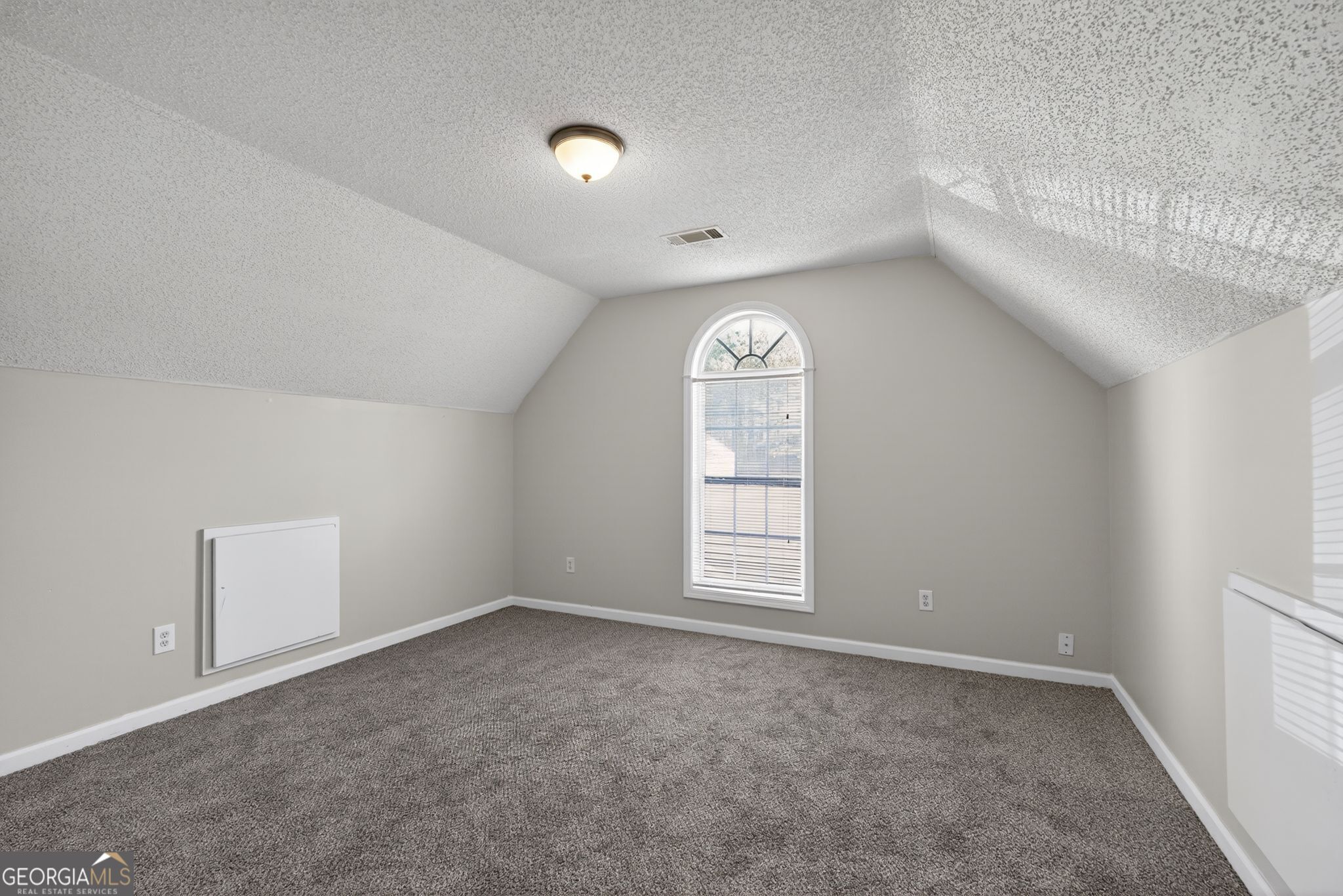 4708 Golod Way Lithonia, GA 30038 - Photo 32 of 33 an empty room with windows and closet