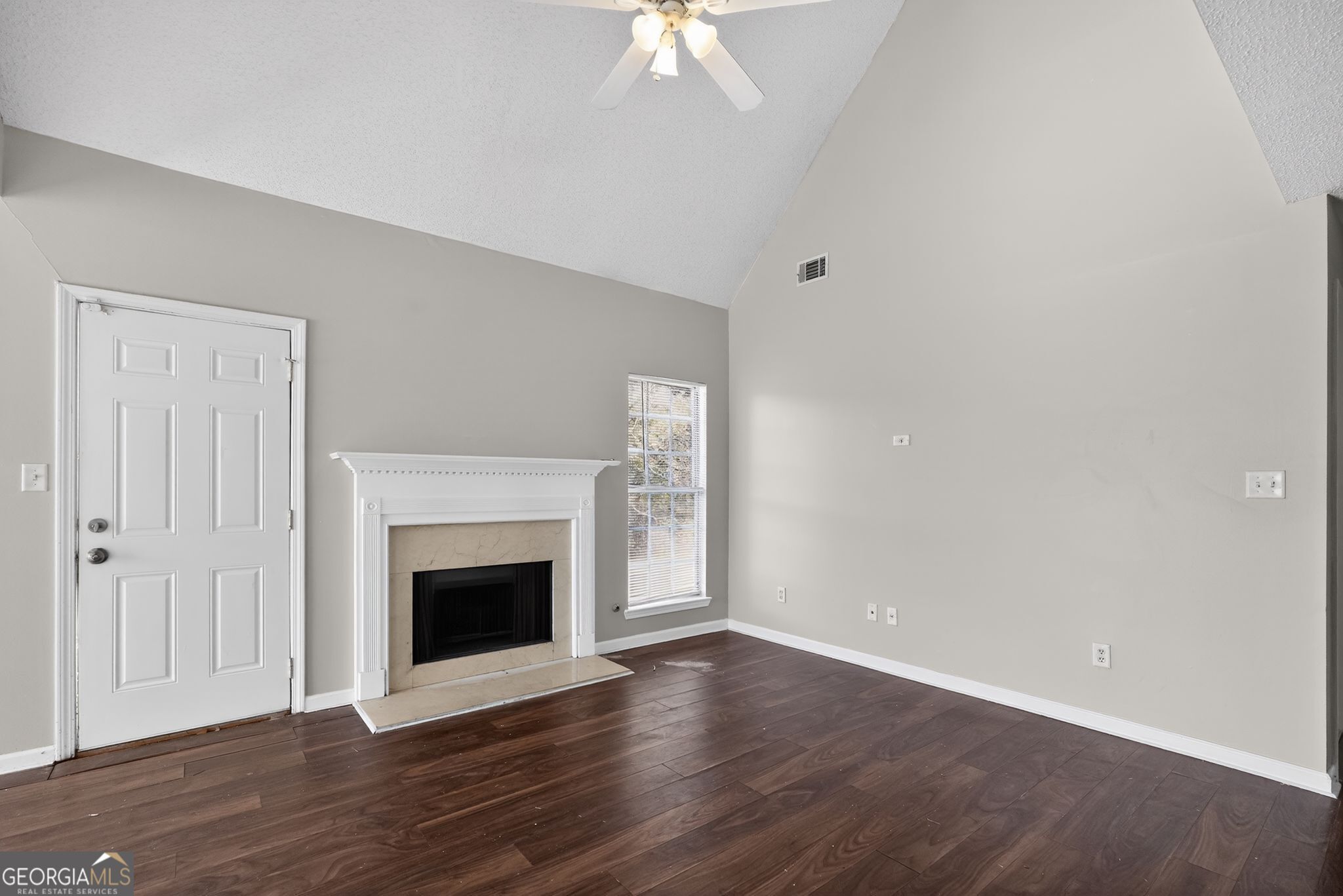 4708 Golod Way Lithonia, GA 30038 - Photo 9 of 33 wooden floor fireplace and natural light in room
