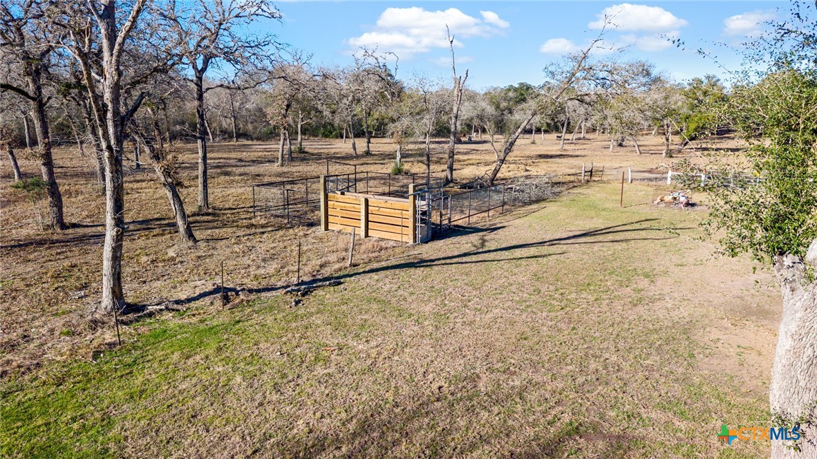 1465 County Road 401 Edna, TX 77957 - Photo 39 of 46 a view of a yard with wooden fence