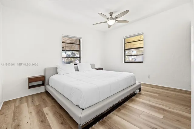 a large white bed in a white room