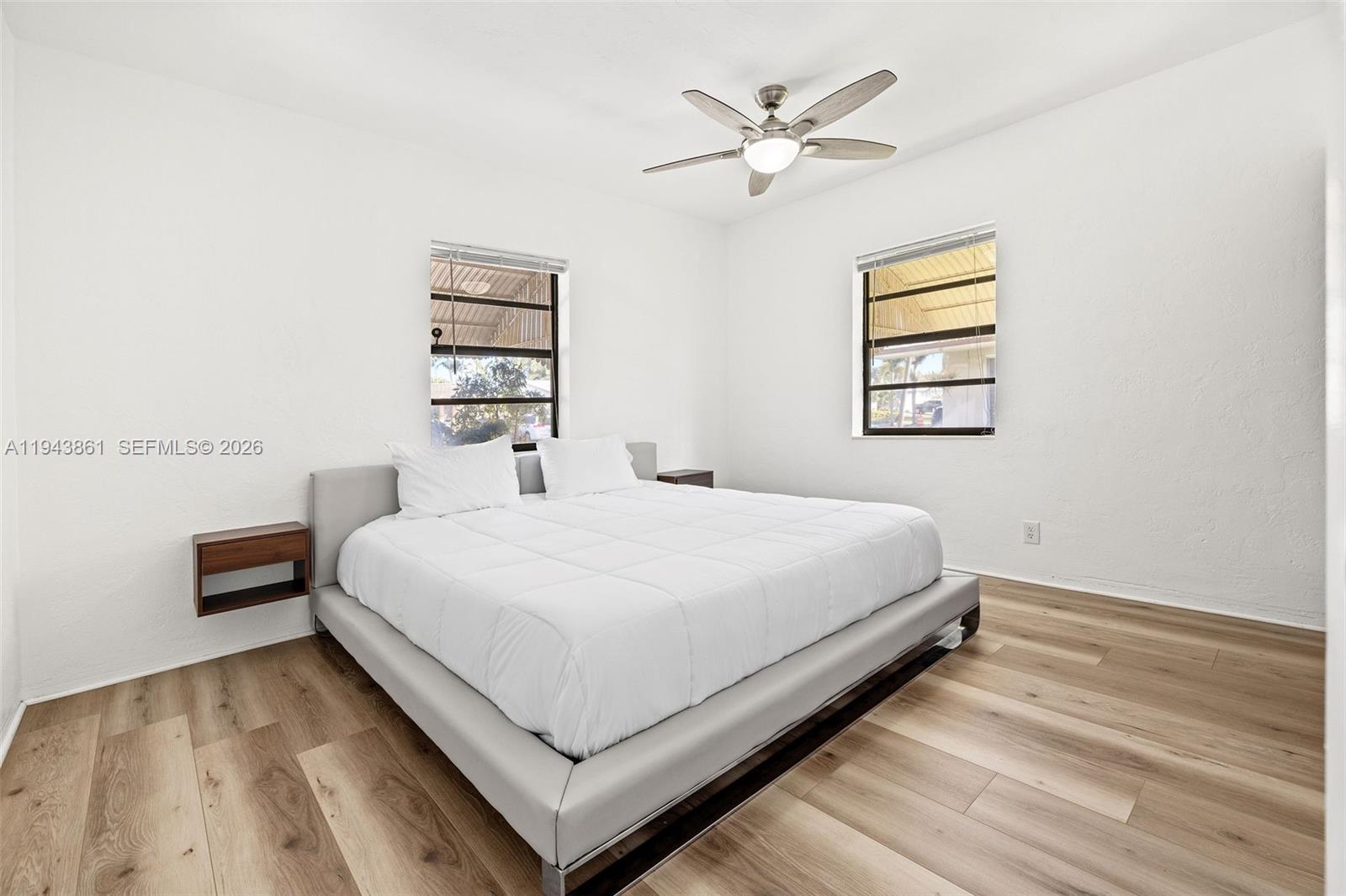 206 Southeast 5th Street Dania Beach, FL 33004 - Photo 11 of 26 a large white bed in a white room