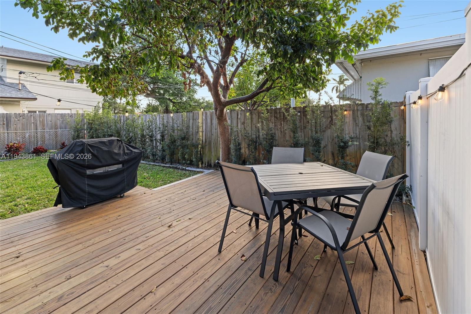 206 Southeast 5th Street Dania Beach, FL 33004 - Photo 20 of 26 a view of a table and chairs on the roof deck