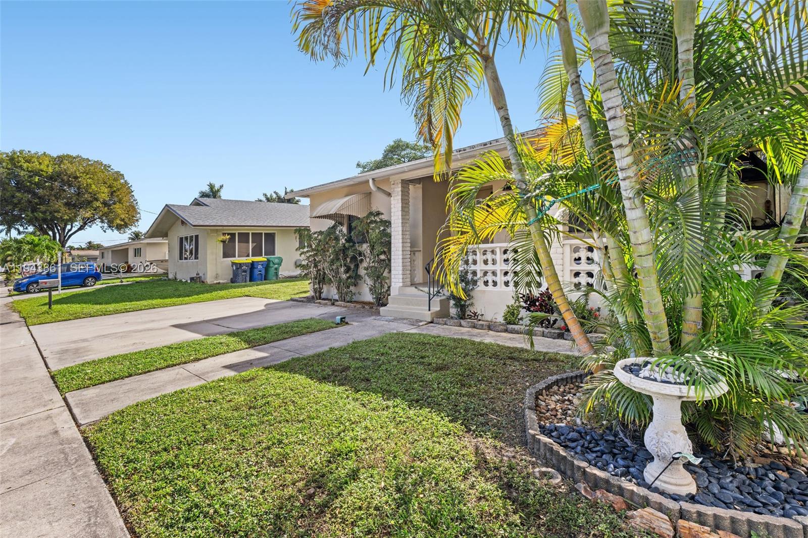 206 Southeast 5th Street Dania Beach, FL 33004 - Photo 26 of 26 a front view of a house with garden