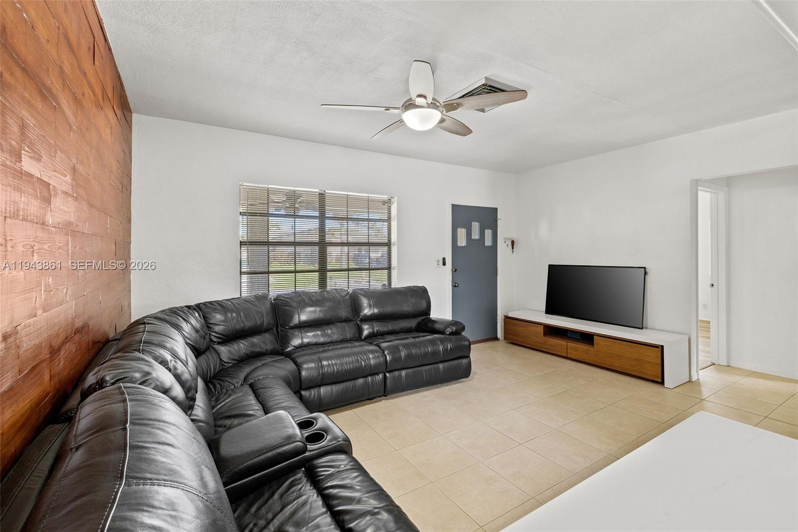 206 Southeast 5th Street Dania Beach, FL 33004 - Photo 5 of 26 a living room with furniture and a flat screen tv