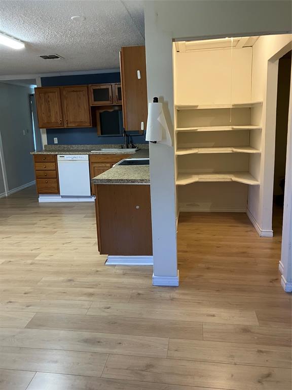 717 Bluebonnet Street Mexia, TX 76667 - Photo 13 of 25 a view of kitchen with furniture and wooden floor