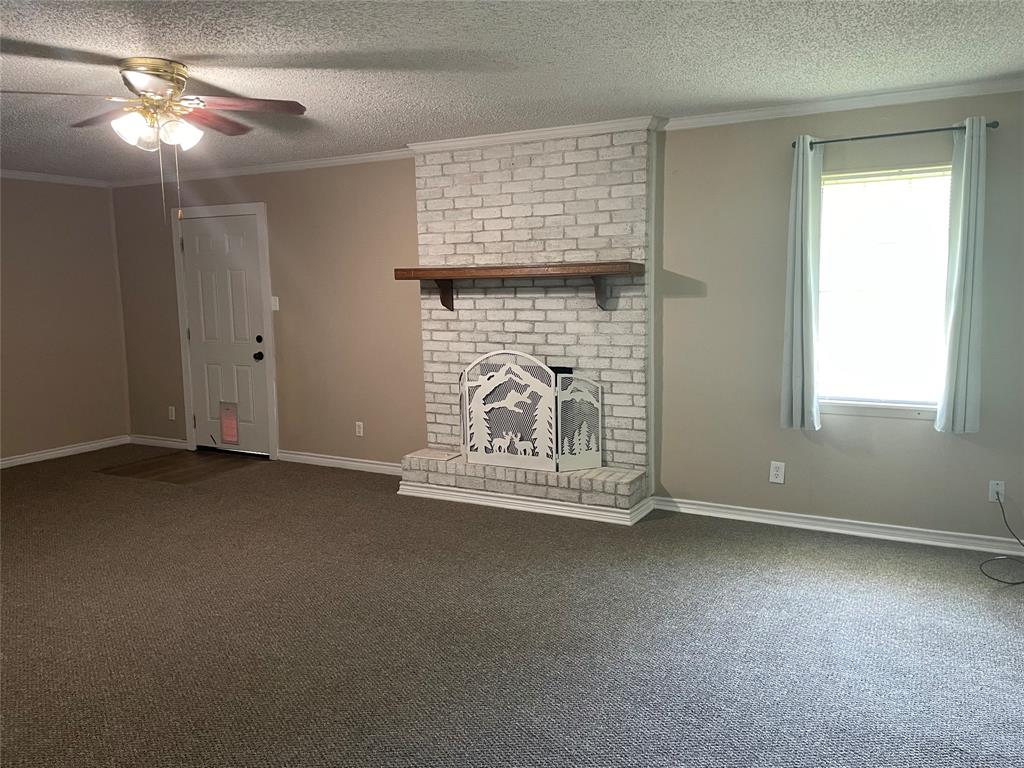 717 Bluebonnet Street Mexia, TX 76667 - Photo 16 of 25 a view of empty room with fireplace
