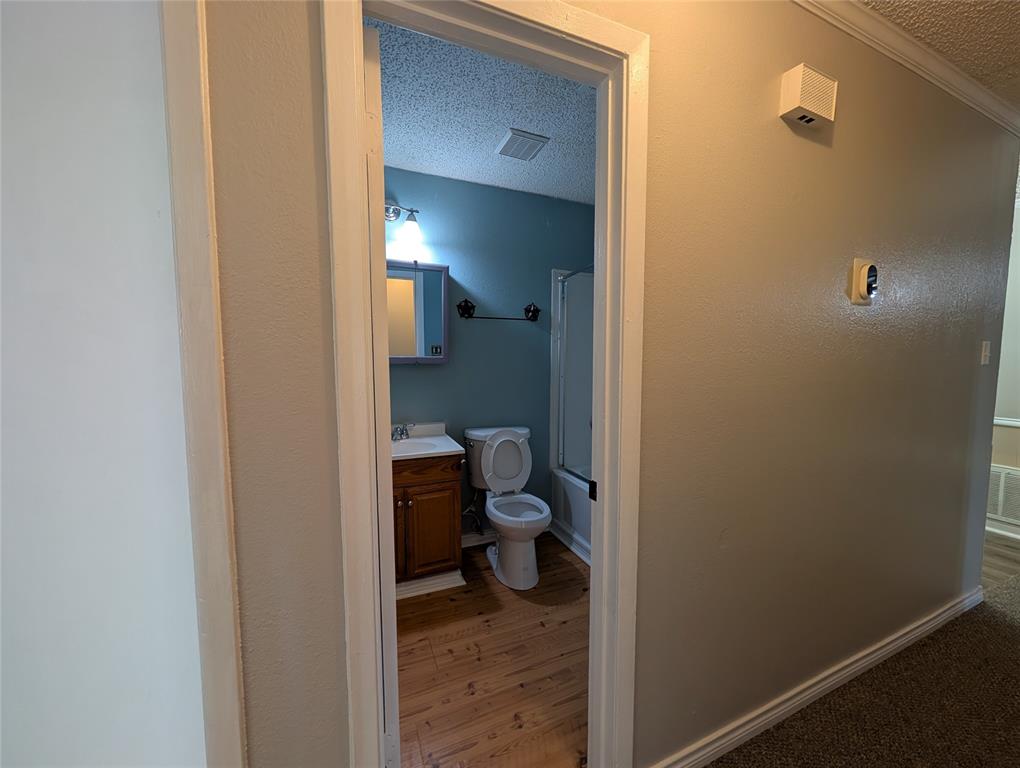 717 Bluebonnet Street Mexia, TX 76667 - Photo 18 of 25 a bathroom with a toilet