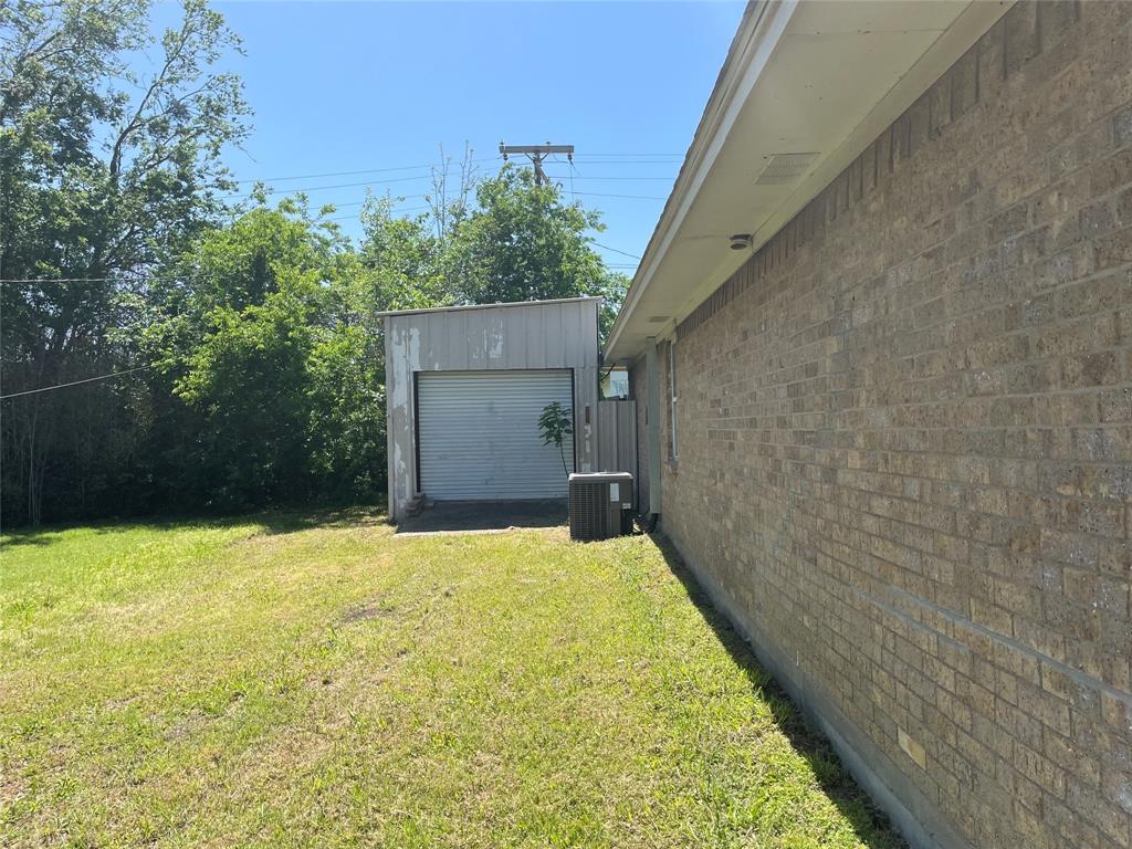 717 Bluebonnet Street Mexia, TX 76667 - Photo 3 of 25 a view of a backyard