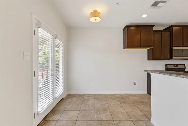 a view of a kitchen with electric appliances