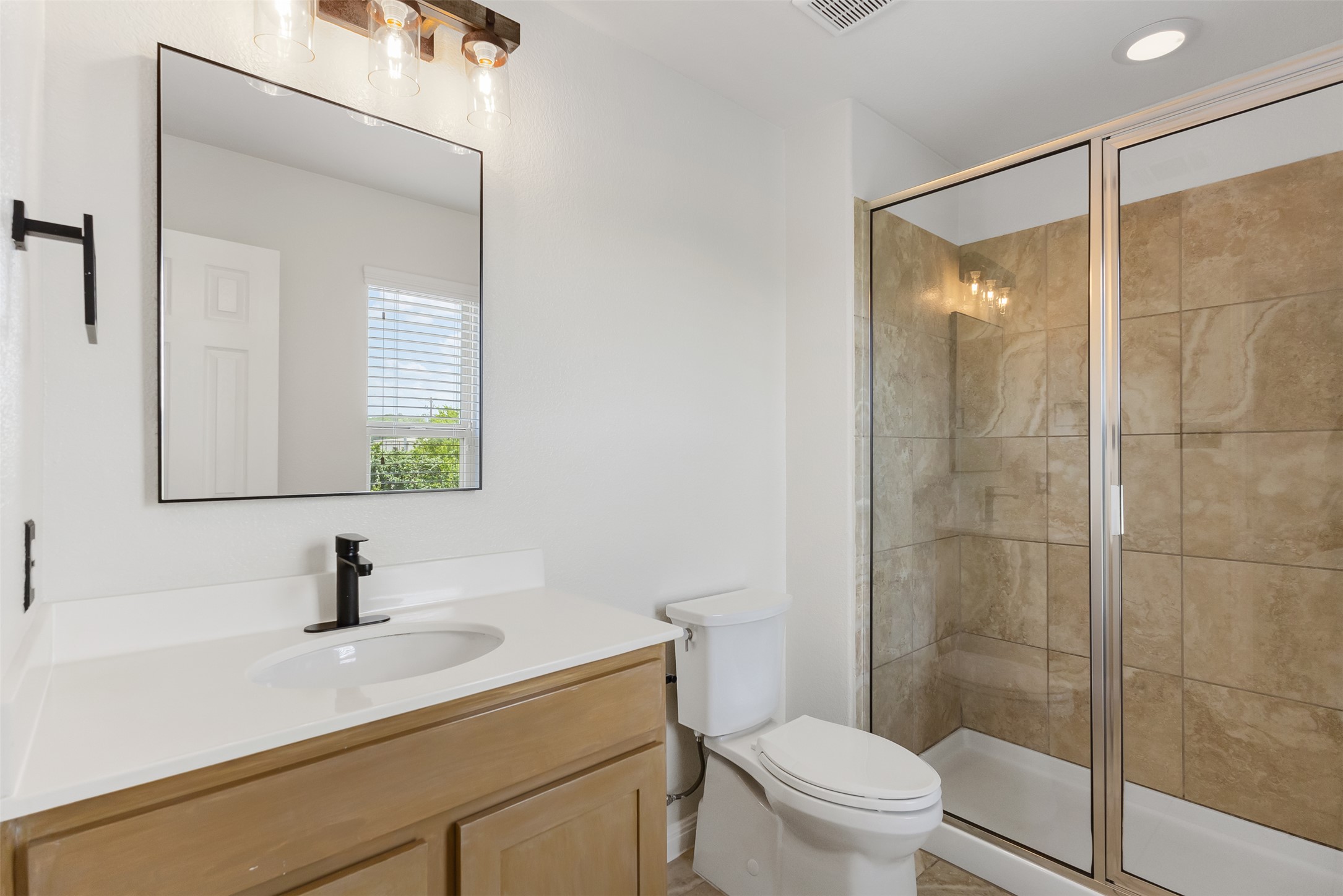 1510 Catalan Road, Unit 602 Austin, TX 78748 - Photo 19 of 36 Full bathroom featuring vanity and a shower stall