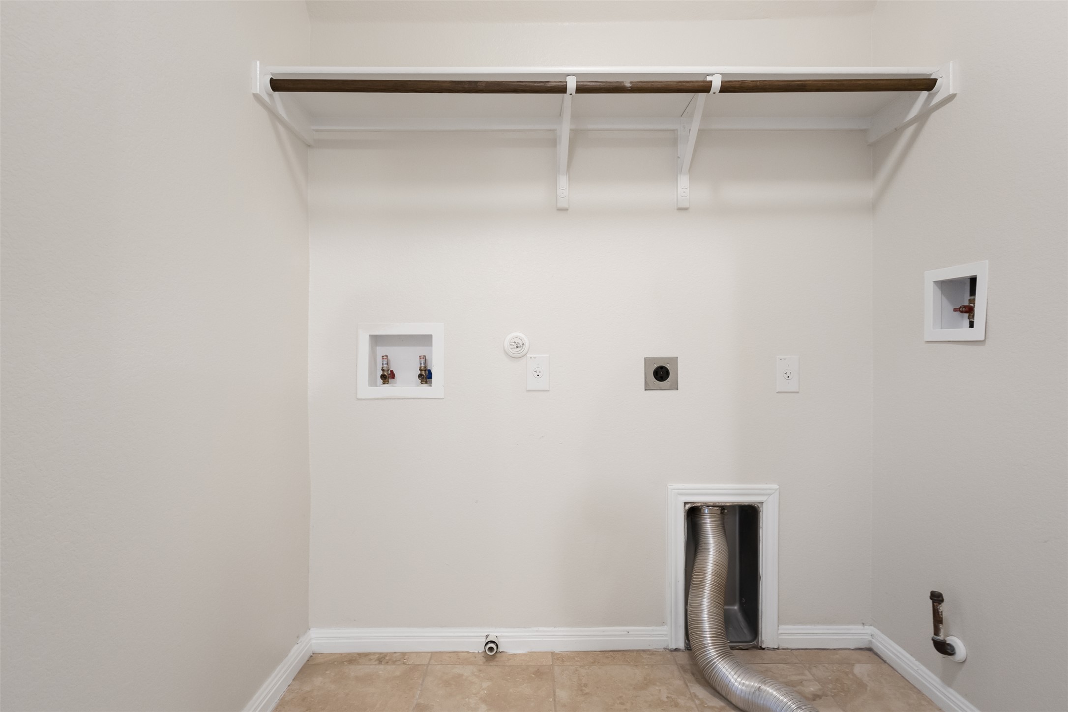 1510 Catalan Road, Unit 602 Austin, TX 78748 - Photo 29 of 36 Laundry room with gas dryer hookup, electric dryer hookup, washer hookup, and light tile patterned floors