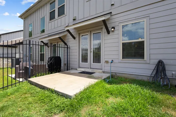 a view of a house with a yard and porch