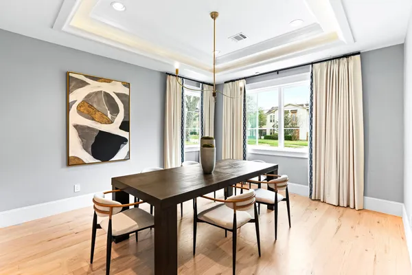 a view of a workspace with furniture and window