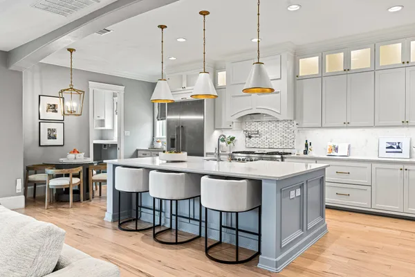 a kitchen with stainless steel appliances granite countertop a sink and stove