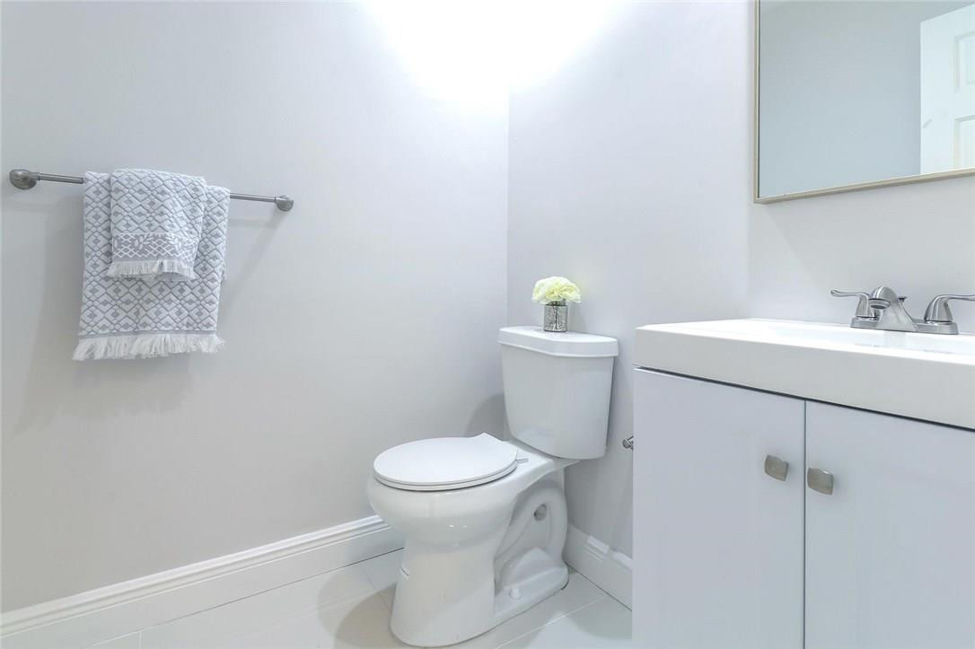 8237 Northwest 200th Terrace Hialeah, FL 33015 - Photo 13 of 30 a bathroom with a sink toilet and a mirror