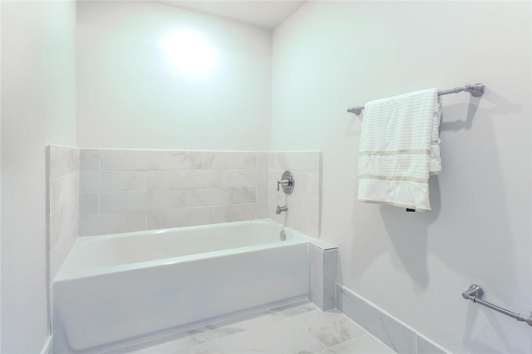 8237 Northwest 200th Terrace Hialeah, FL 33015 - Photo 19 of 30 a bathroom with a bathtub