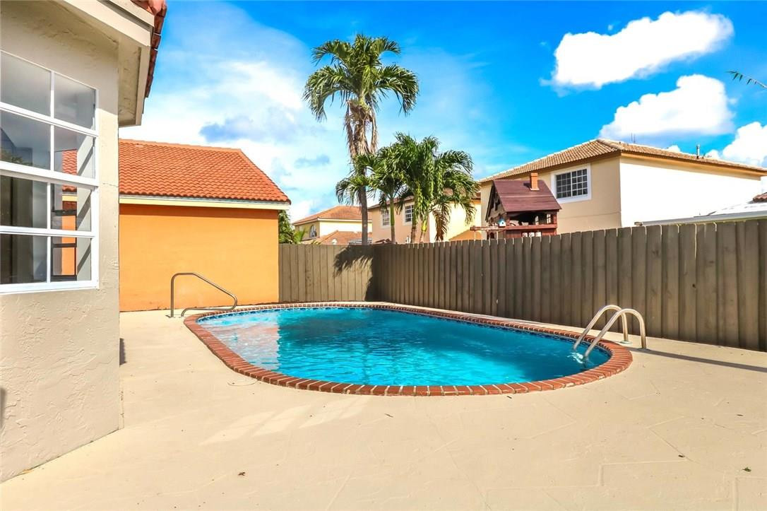 8237 Northwest 200th Terrace Hialeah, FL 33015 - Photo 30 of 30 a view of outdoor space and swimming pool