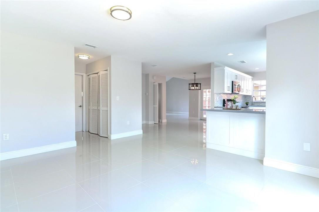 8237 Northwest 200th Terrace Hialeah, FL 33015 - Photo 6 of 30 a view of a kitchen with refrigerator and a sink