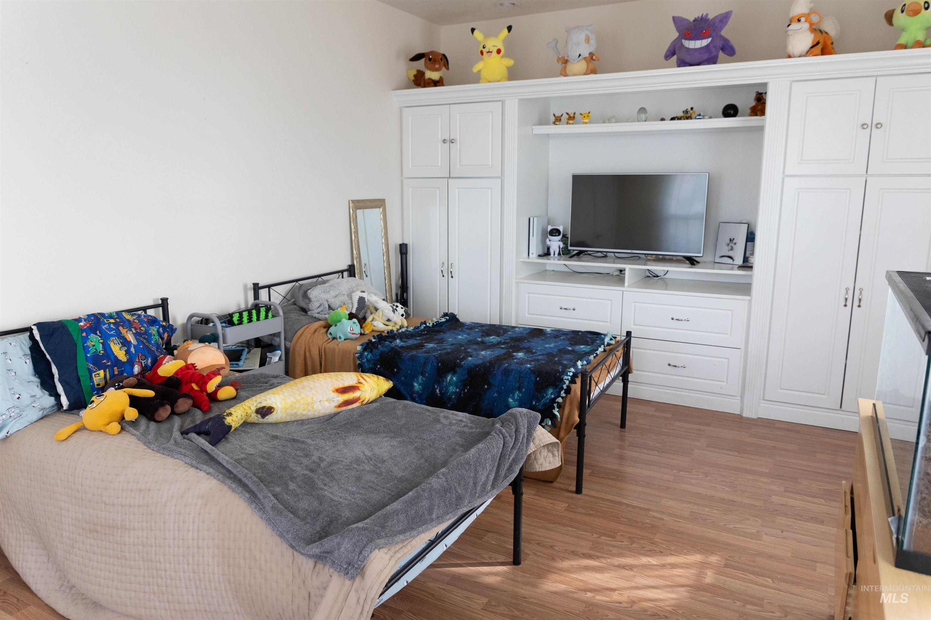 765 Southwest Foley Street Mountain Home, ID 83647 - Photo 16 of 37 Bedroom with light wood finished floors