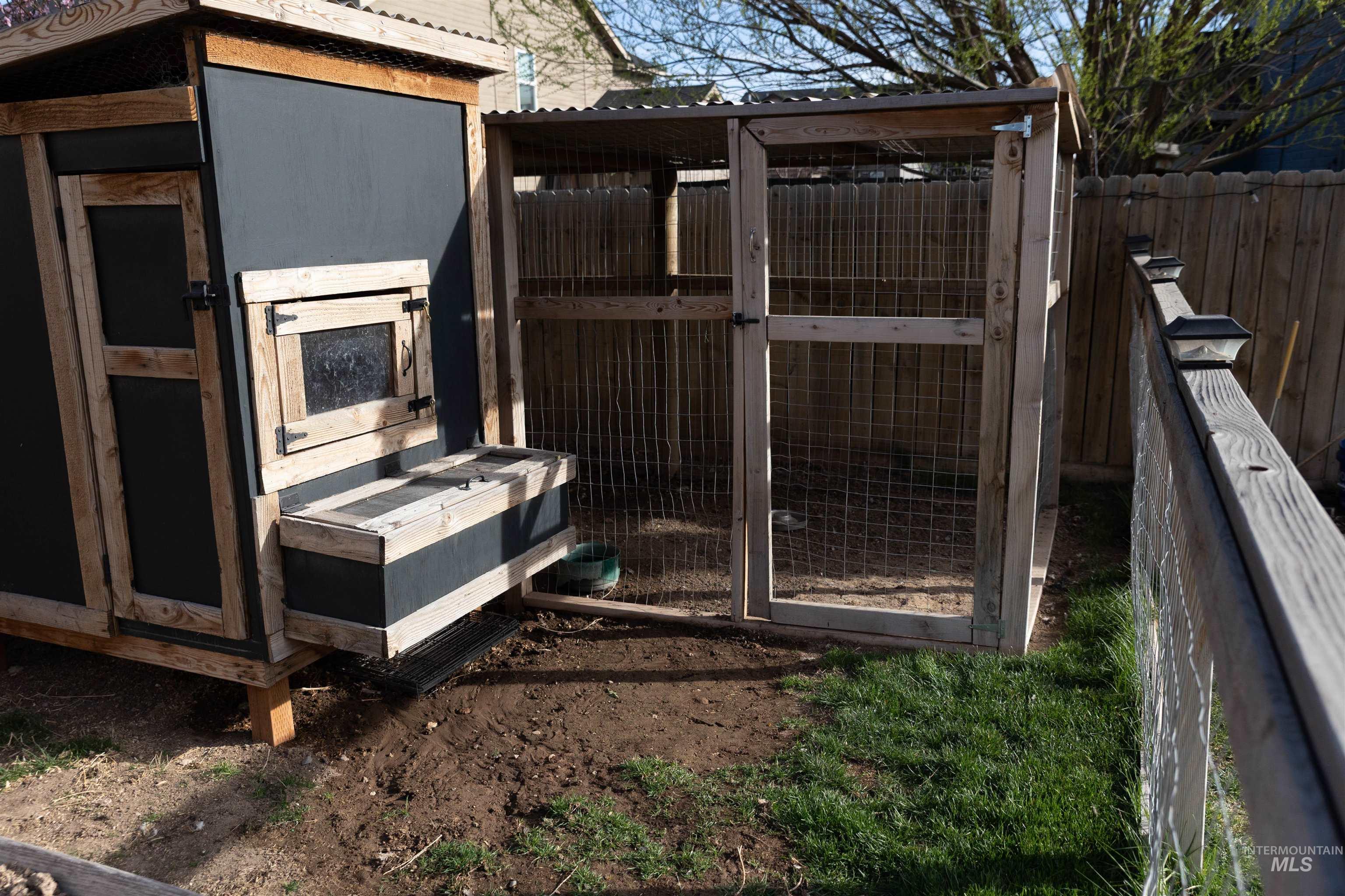 765 Southwest Foley Street Mountain Home, ID 83647 - Photo 34 of 37 View of chicken coop with a fenced backyard