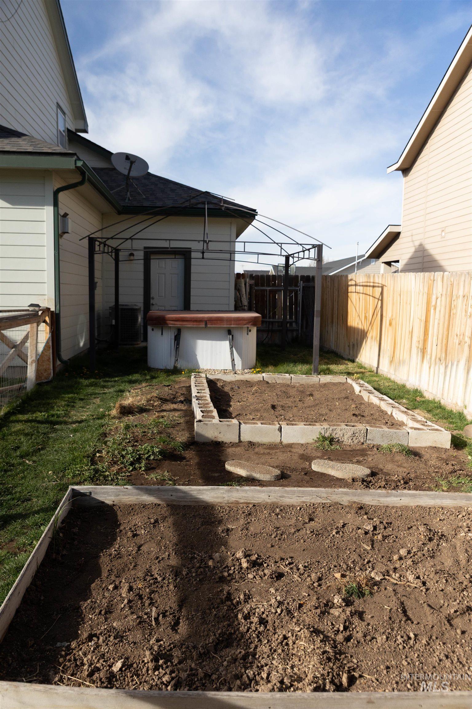 765 Southwest Foley Street Mountain Home, ID 83647 - Photo 35 of 37 Fenced backyard with a vegetable garden