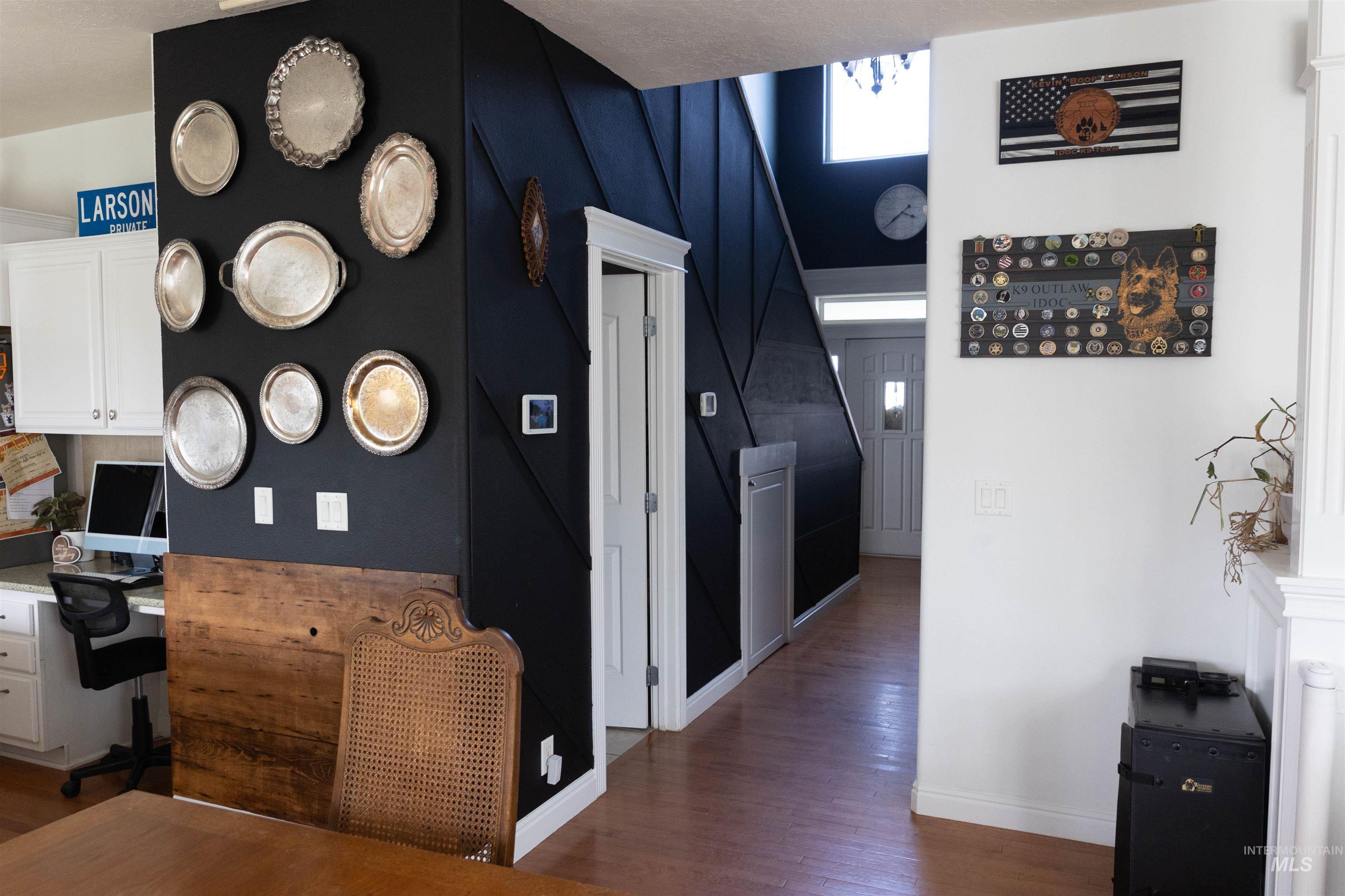 765 Southwest Foley Street Mountain Home, ID 83647 - Photo 7 of 37 Corridor with an office area and dark wood-type flooring