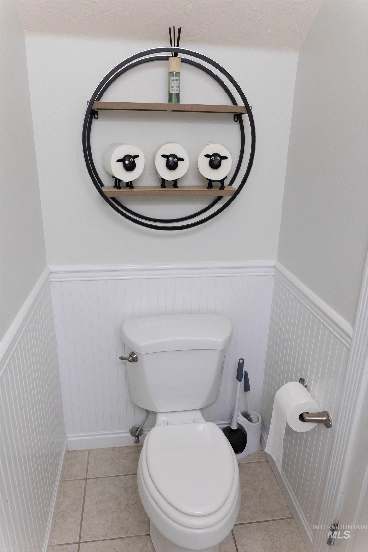 765 Southwest Foley Street Mountain Home, ID 83647 - Photo 9 of 37 Bathroom featuring wainscoting and light tile patterned floors