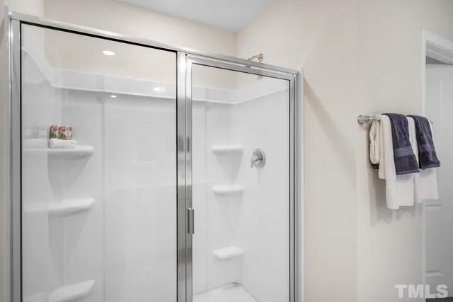 a bathroom with a shower and toilet