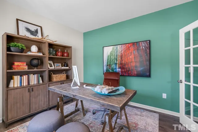 a view of a workspace with furniture