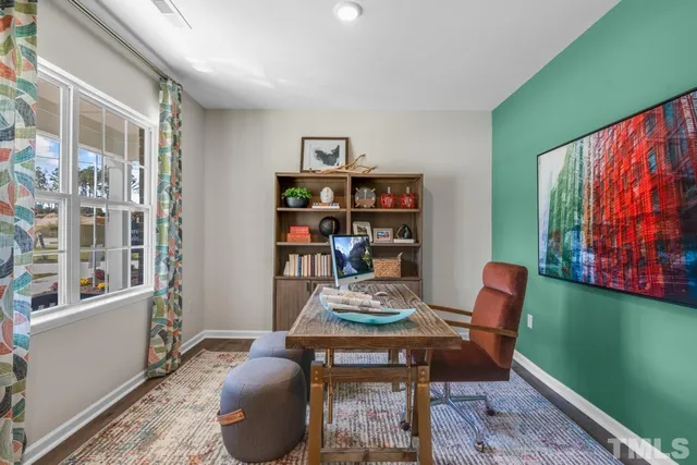 a reading room with furniture and a book shelf