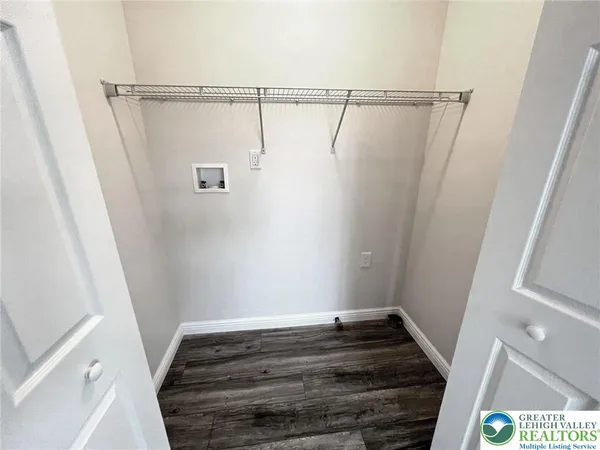 a bathroom with a shower and a sink