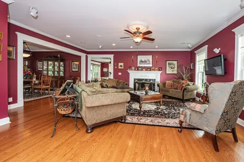 a bathroom with a sink a large mirror and a shower