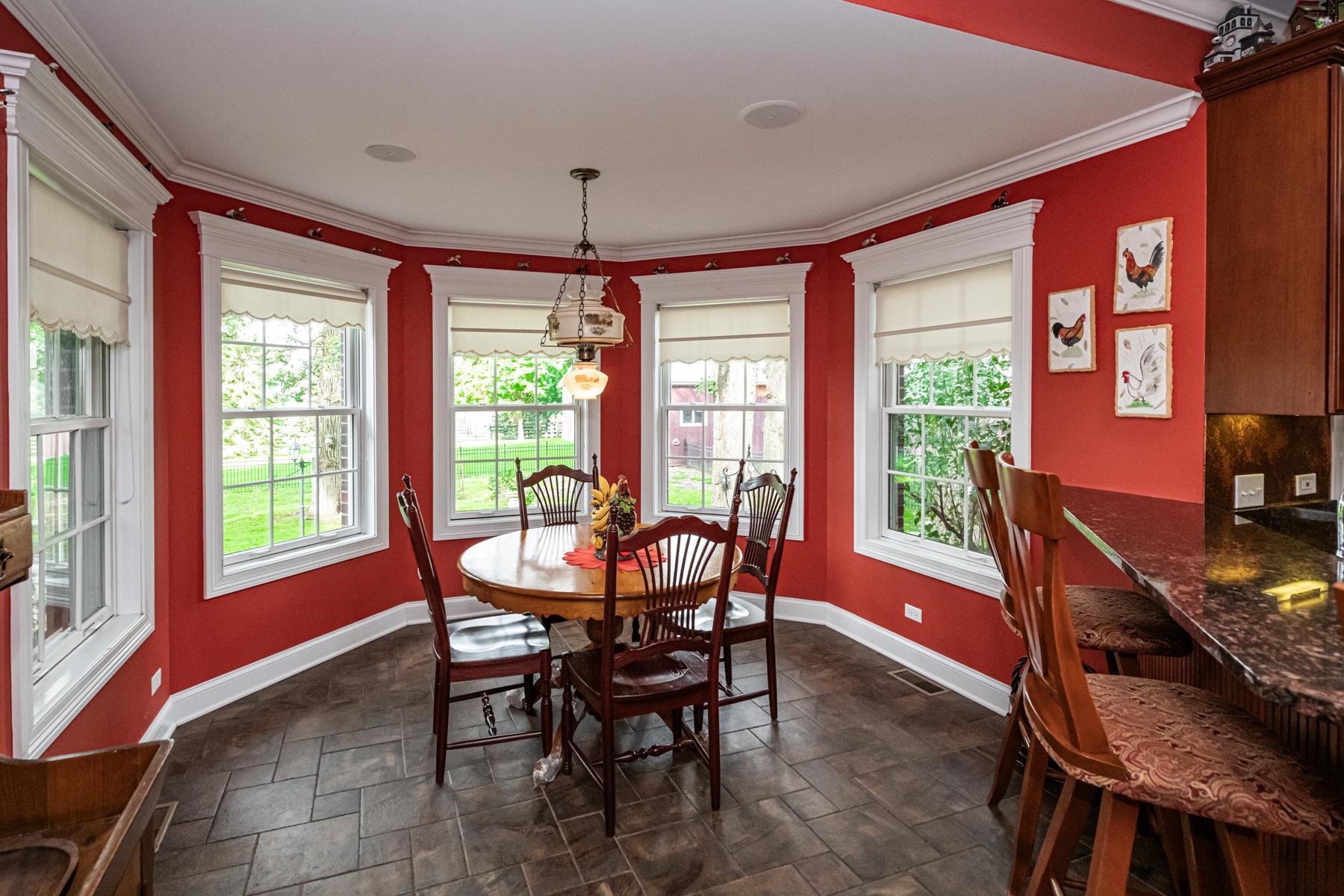 6715 Meyer Road Marengo, IL 60152 - Photo 17 of 72 a dining room with furniture a chandelier and wooden floor