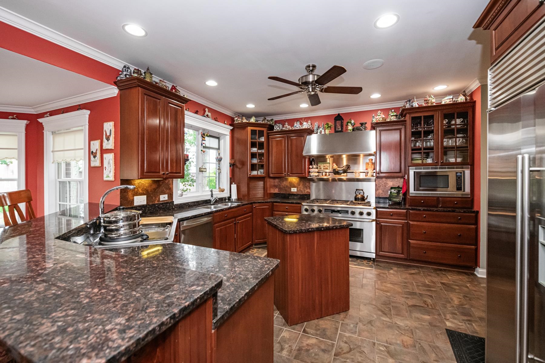 6715 Meyer Road Marengo, IL 60152 - Photo 18 of 72 a kitchen with stainless steel appliances granite countertop a sink and a stove