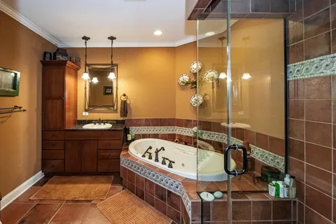 a bed room with a bed a couch and dresser